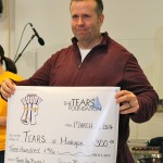 Buddy Shuh was presented with a donation to the TEARS Foundation. He is president of the Michigan Chapter.
