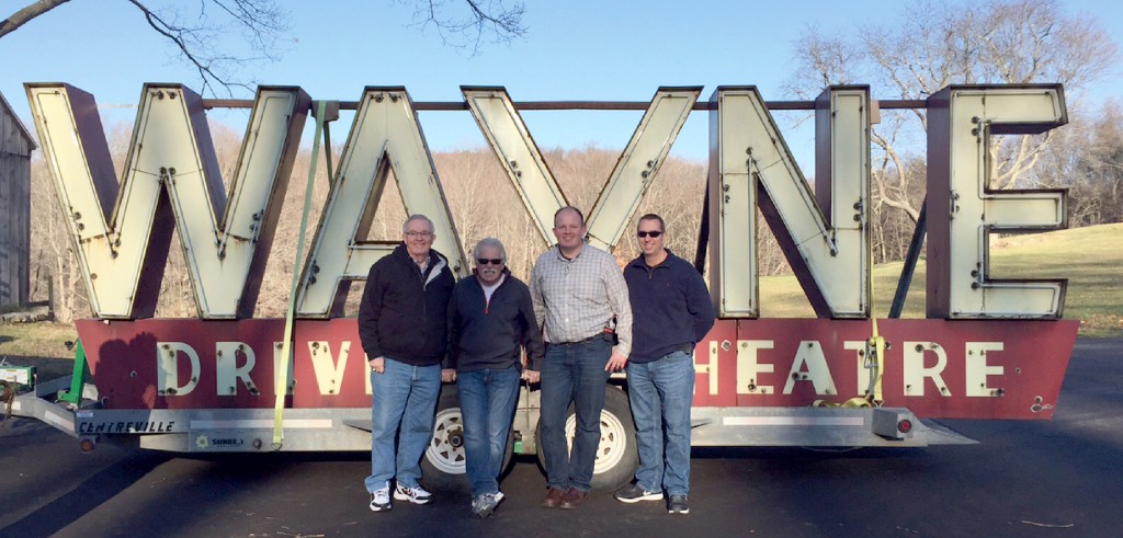 Standing in front of the Wayne Drive-In sign are Wayne Carini (second from left), Nathan Lippe (third from left) and two friends.
