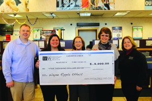 Chief Information Officer Dave Story, Compliance Officer Tracy Whittaker, Chief Executive Officer Thelma Dasho and Human Resource manager Ruth Strozeski present, on behalf of the Wayne Westland Federal Credit Union, to Ripple Effect  Representative Cindy Schofield a $5,000 check for the Main Street Program. Photo by Jenny Johnson