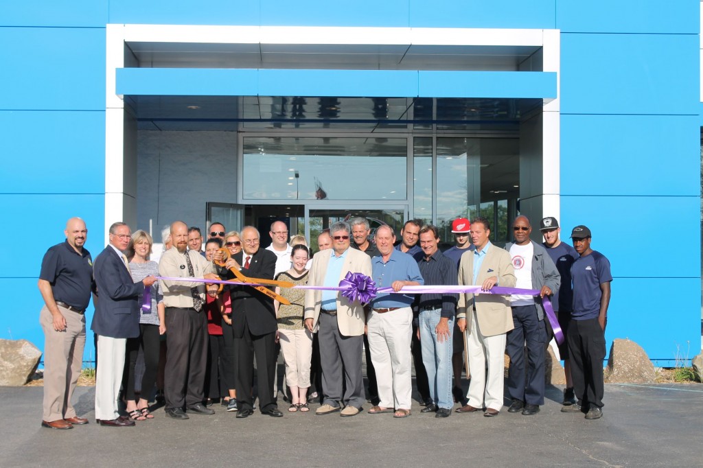 City officials and the staff at Mark Chevrolet celebrate the completion of the renovations with a ribbon cutting celebration. 