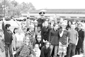 Hail to the Chief -  Students at St. Michael Lutheran School say goodbye to Police Chief Jason Wright who retired on Oct. 17. Photo John P. Rhaesa