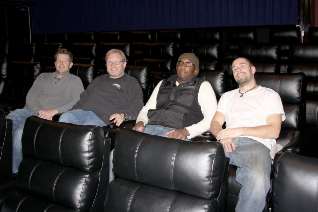 John Scanlan, Cory Jacobson, Tearis Reid and Joe Cork kick back and relax after installing the new luxury electric reclining seats. Photo by John P. Rhaesa