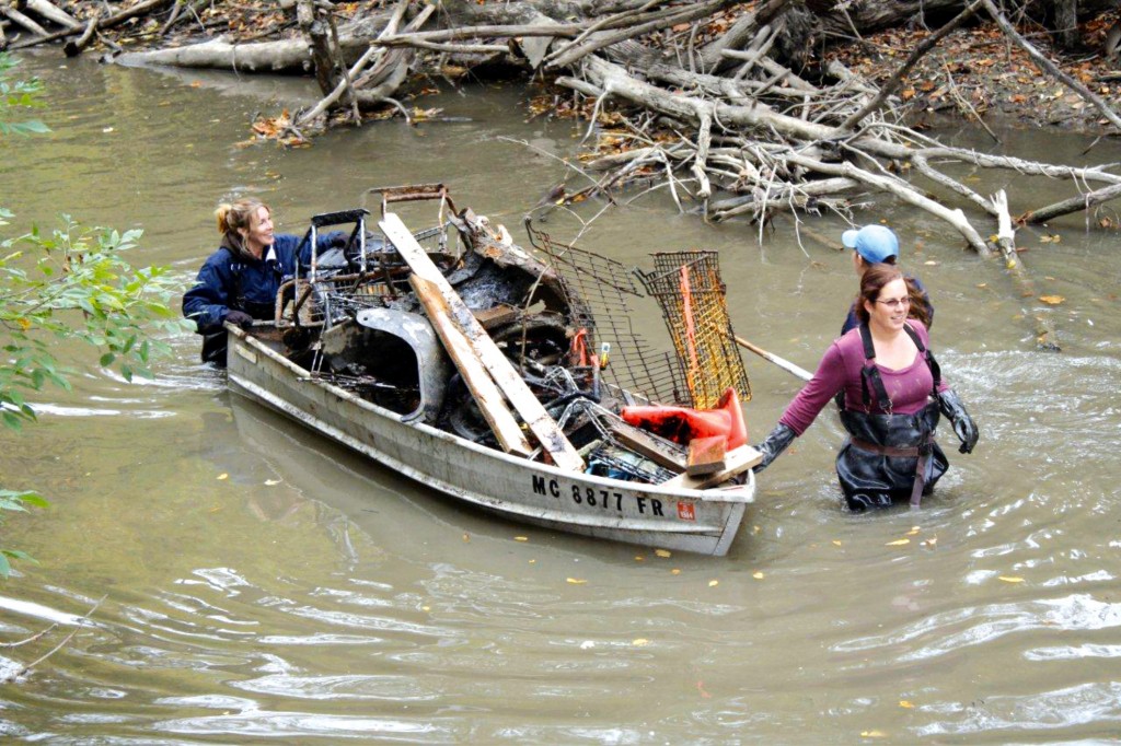 Volunteers remove debris from the Rouge River. This year’s annual river clean up takes place on May 30. 