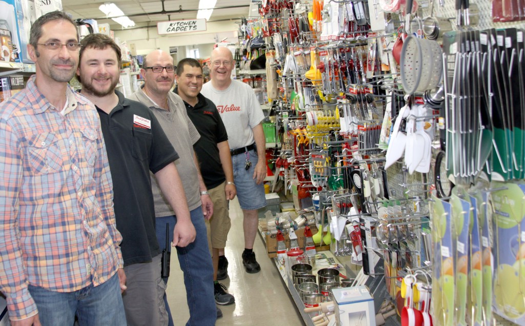 Sam Yono, Jordan Montgomery, Bashar Yono, Ken Dahn and Jim Cox in the new and improved houseware department at Northside Hardware. Photo by John P. Rhaesa