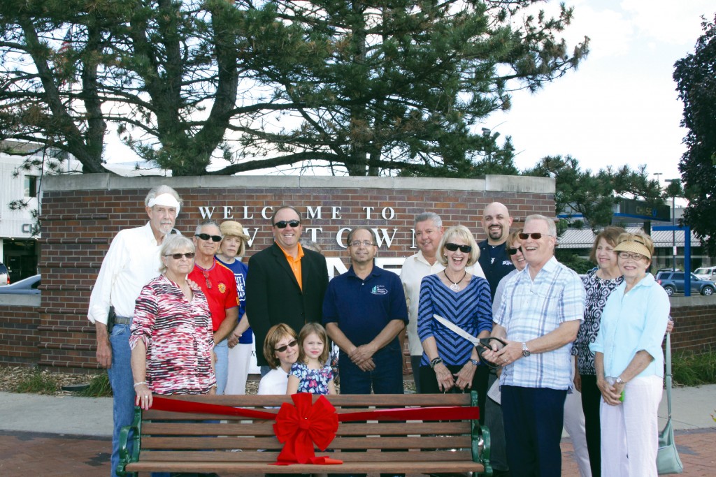 Gordon Jones prepares to cut the ribbon on the bench sponsored by American Jetway in Downtown Wayne with the other bench sponsors looking on. Photo by Carolyn Marnon