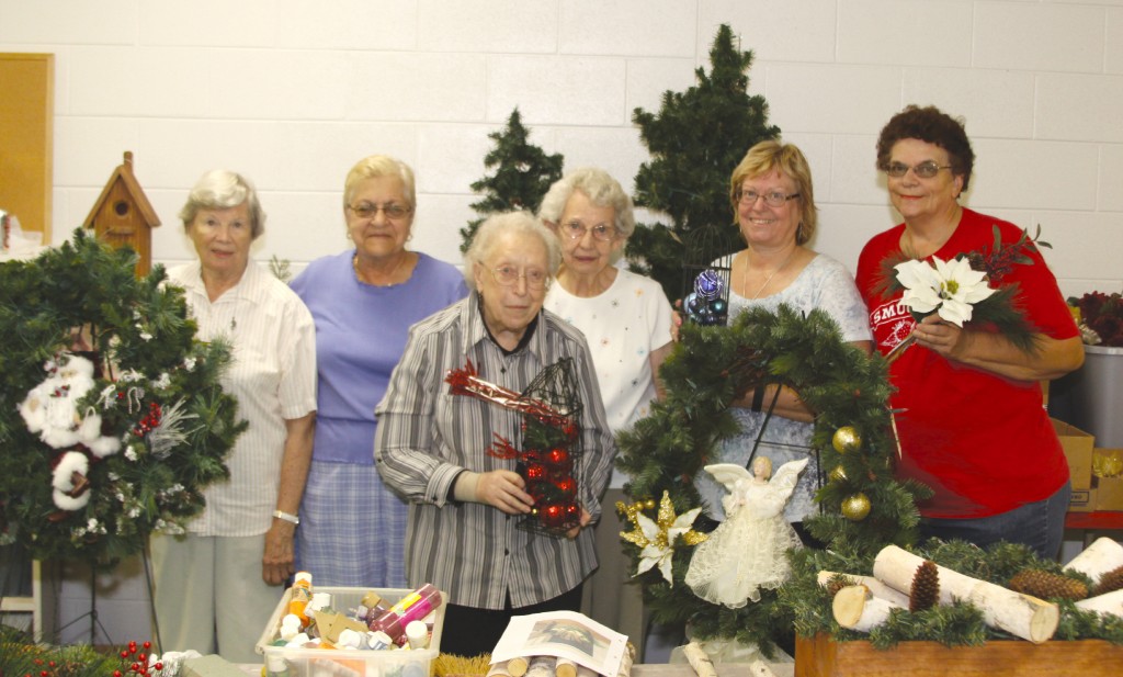 Lucille Cobenaw, Brenda Armstrong, Kathy Kovaleski, Miriam Shurlow, Mary Carney and Veronica Hoops show off some of the wreaths that will be sold on November 5th and 6th at The First Congregational Church.