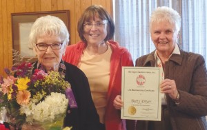 Betty Dryer is awarded a Michigan Garden Clubs, Inc. State Life Membership at the Wayne Garden Club’s November meeting by Co-Presidents Tina Butler and Lois VanStipdonk.