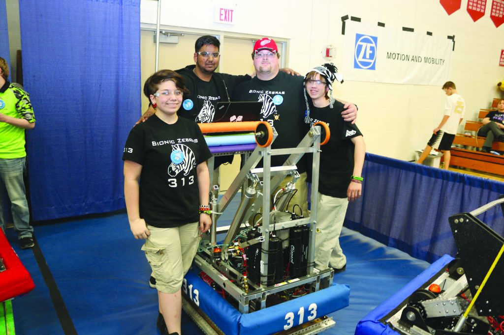 The build team Oliver Gietzen, Naaman Chaudray, Karl Heinrich and Teddy Ivanac waiting for their turn at the Robotics competition the Livonia Churchill. Photo by John Rhaesa