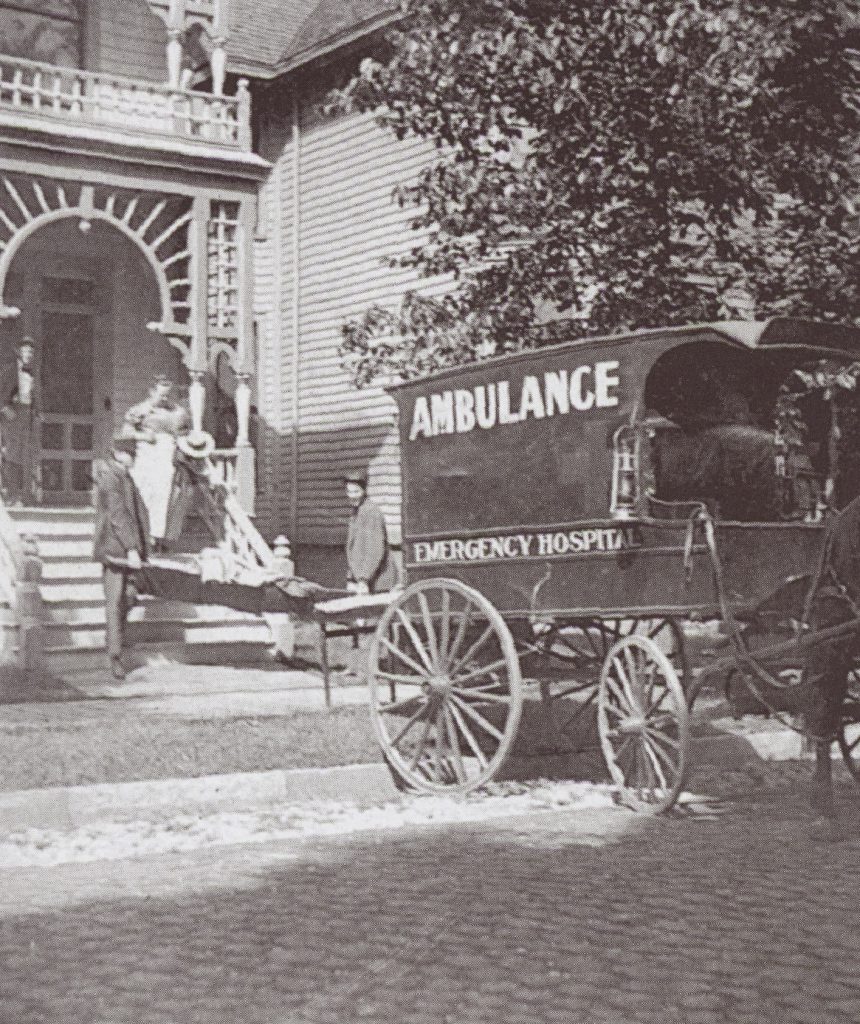 The emergency hospital ambulance in 1901. Dr. Earle, a well known Wayne doctor, is standing on the porch at the left.    