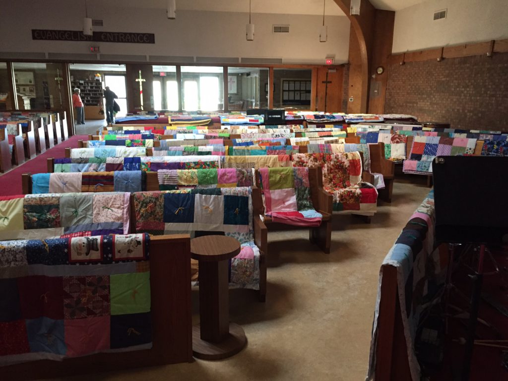 St. Michaels Lutheran Church draped 270 quilts on the pews of  their sanctuary to display them for their congregation, community and friends they will be packed and shipped by train to the Lutheran World Relief Center to be distributed throughout the world to those in need.  